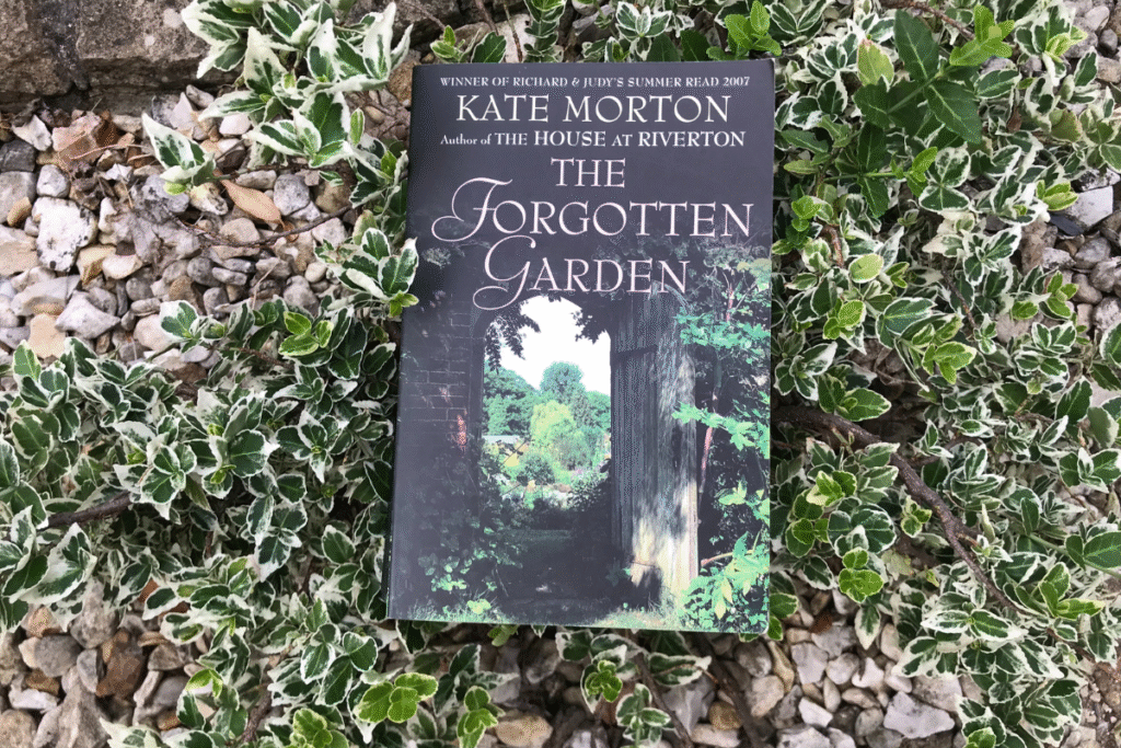 The Forgotten Garden by Kate Morton resting in a gravel garden