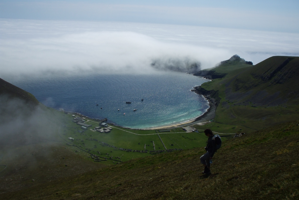 Jackie Watson climbing down to the deserted village surrounding Village Bay on Hirta. One of the islands in the St Kilda archipelago
